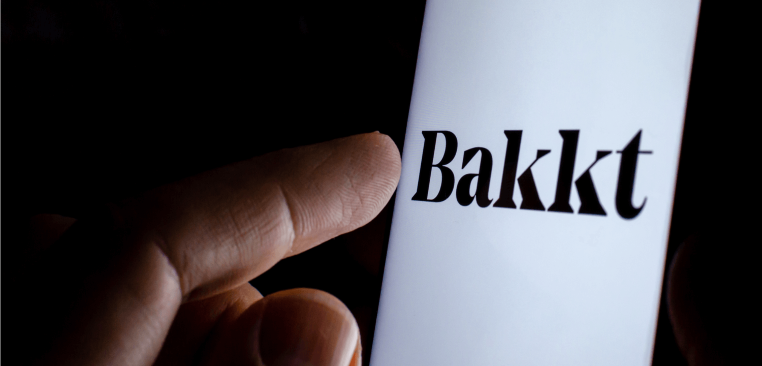 Bakkt company logo on the smartphone screen in a dark.